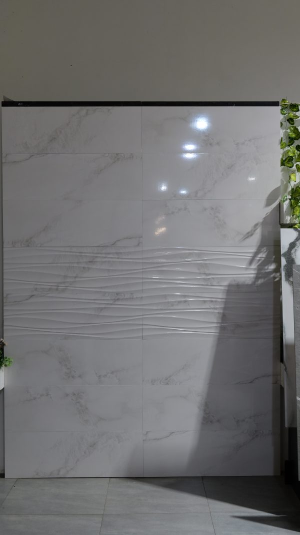 Elevate your space with Kelodiya Plain/Decor 300 x 900 mm wall tiles. Featuring a sleek and simple design, these high-quality ceramic tiles offer a modern look for any room. Perfect for creating minimalist feature walls.